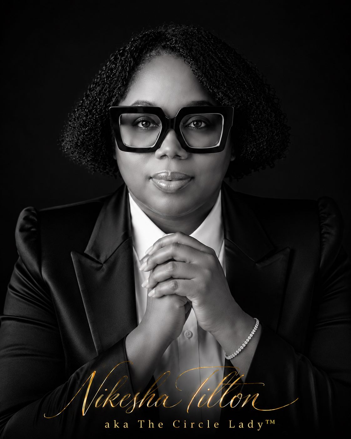 Black and white portrait of Nikesha Tilton, hands clasped, signed Nikesha Tilton aka The Circle Lady